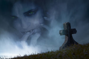 a cross-shaped grave on a hill. In the background is a large superimposed picture of a person with vampire teeth